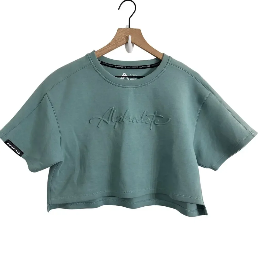 Alphalete Woman’s ELMTS Short Sleeve Crop Top Teal Blue Size Small